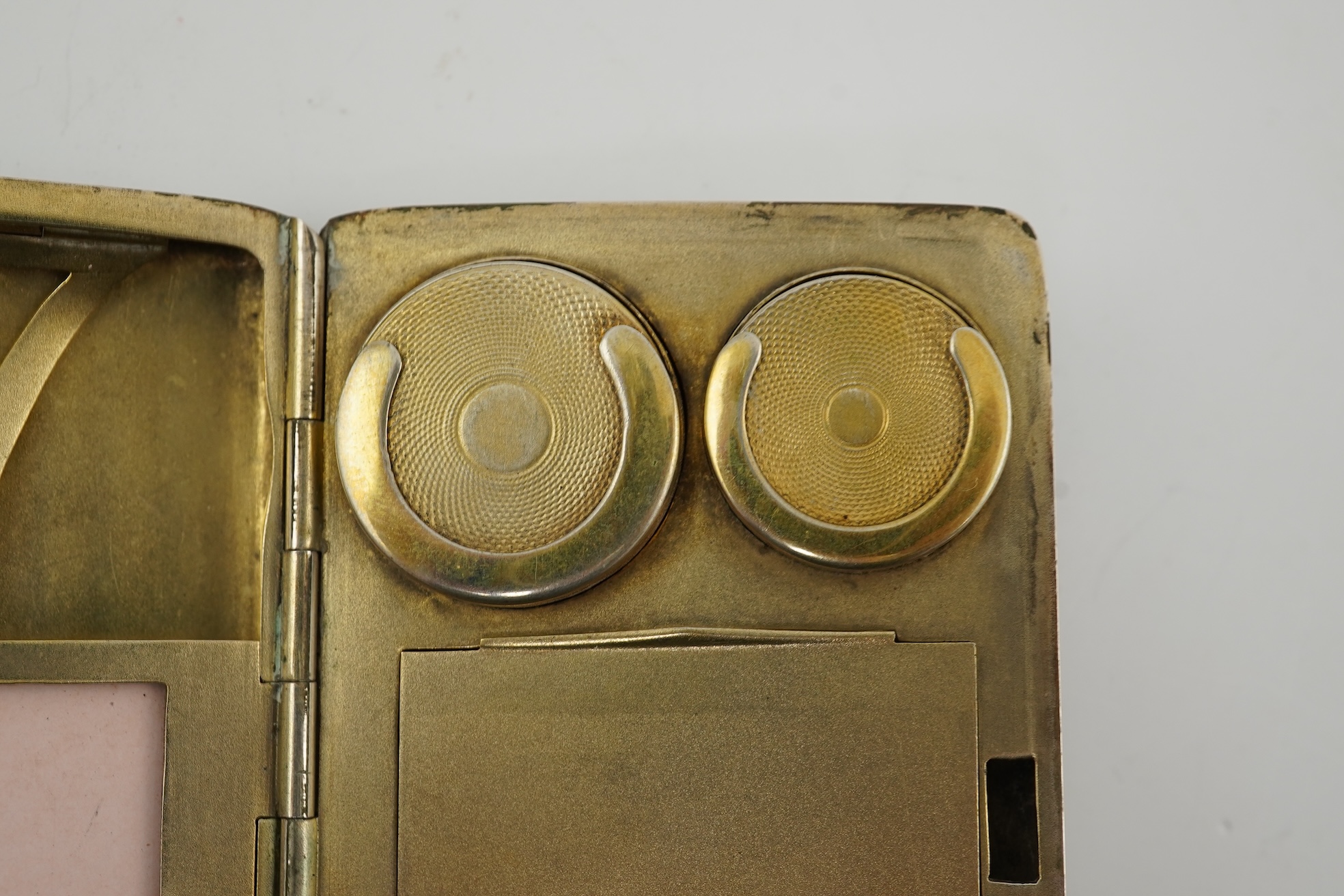 An early 20th century continental 800 standard silver combination, card, coin, aide memoir and pill case, with pencil and ribbed decoration, maker WK